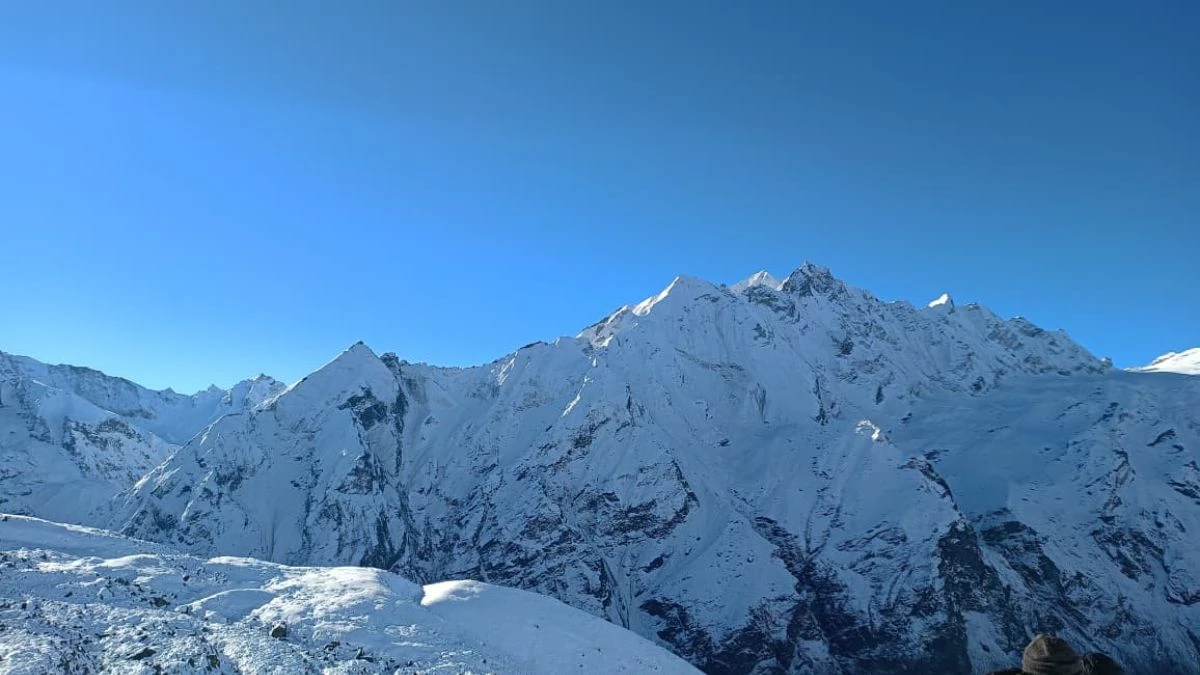 Panoramic snow-capped Himalayan peaks visible from a high viewpoint near Langtang