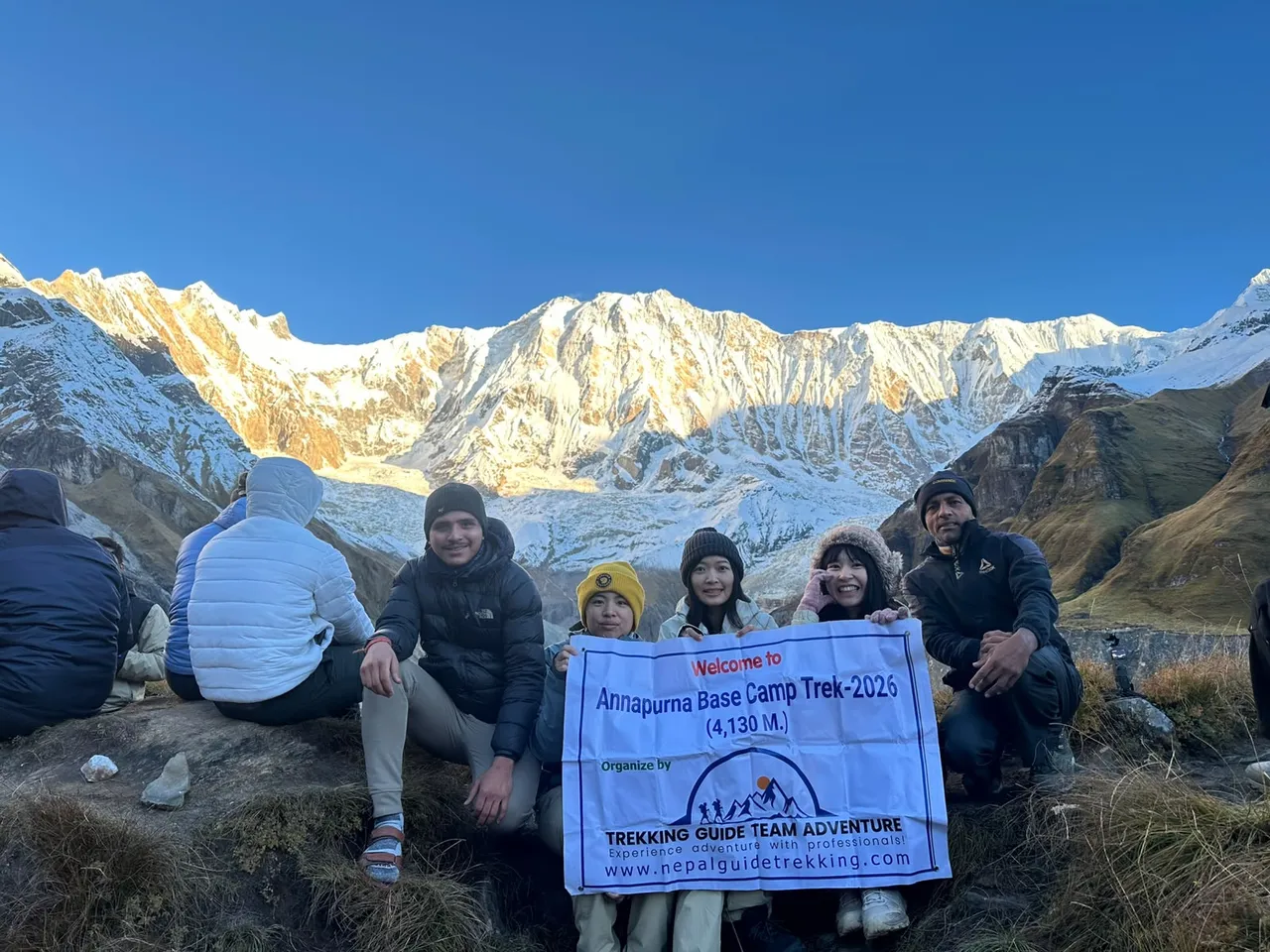 Trekking group at Annapurna Base Camp 4130m at sunrise
