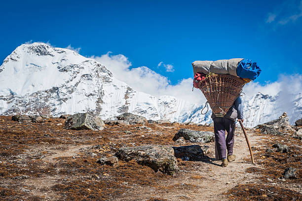 Porter-Carrying-Heavy-Load-Mountain
