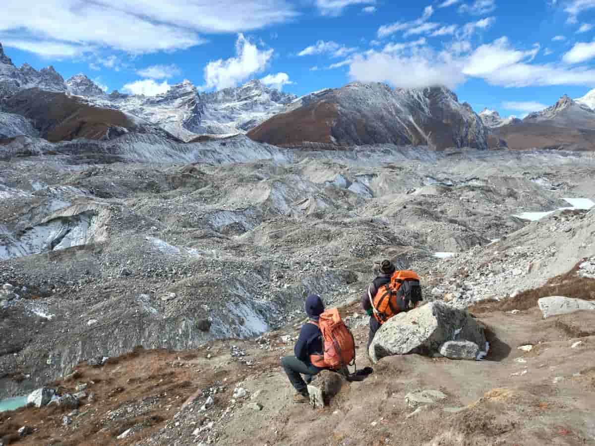 Trekker and porter resting Everest Region