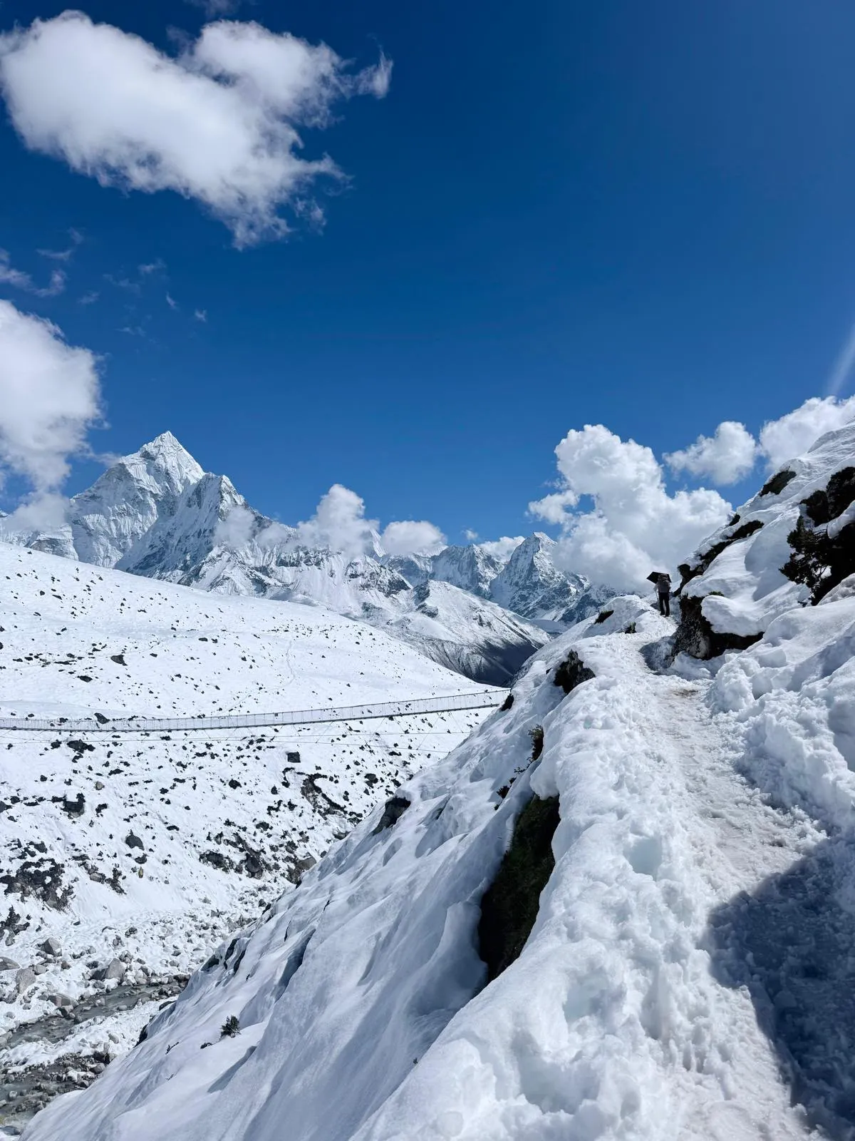 Snowy Everest Base Camp trail with Ama Dablam in the background