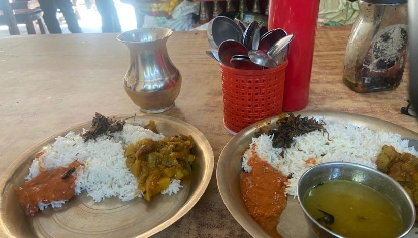 A picture showing two plates of Nepali food - Daal bhat