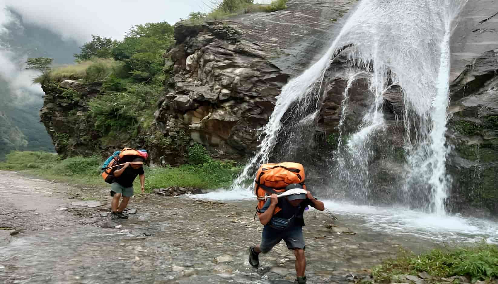 Porters carrying loads on the Manaslu Circuit Trek