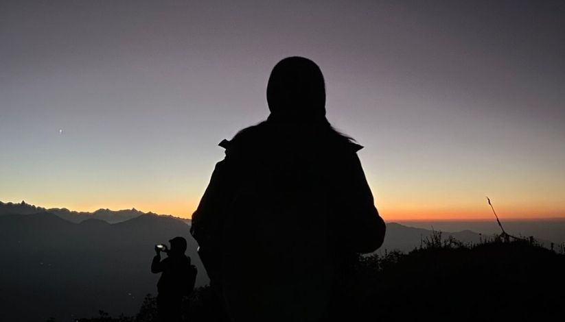A silhouette of trek during sunrise in Ama yangri trek