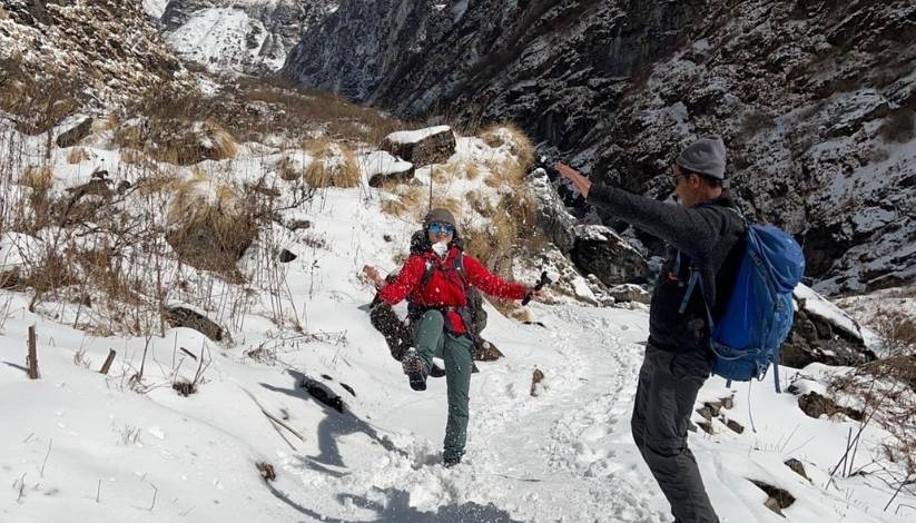 Two trekkers playing joyfully on their way Annapurna Base Camp