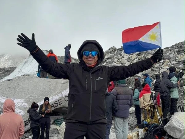 Trekker Celebrating Everest Base Camp 5364m